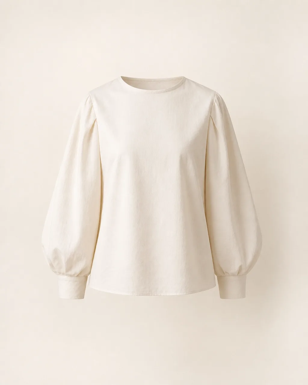 Ivory sculpted blouse in a considered Auren wardrobe